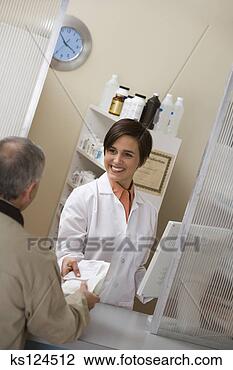 Stock Photo - man picking up 
prescription from 
pharmacist. fotosearch 
- search stock 
photos, pictures, 
images, and photo 
clipart