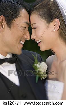 Arquivo de Fotografia - newlyweds,  rosto, 
 rosto. fotosearch 
- busca de fotos, 
imagens e clipart