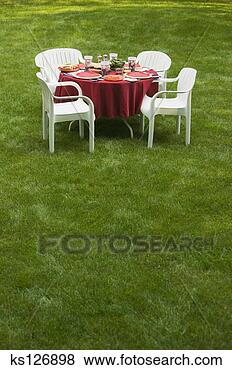 Stock Photo - dining table on 
lawn. fotosearch 
- search stock 
photos, pictures, 
images, and photo 
clipart