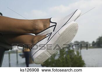 Stock Photo - feet in loafers. 
fotosearch - search 
stock photos, 
pictures, images, 
and photo clipart