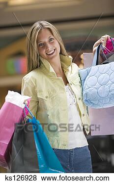 Banco de Imagem - sorrindo,  mulher, 
 shopping,  sacolas. 
fotosearch - busca 
de fotos, imagens 
e clipart
