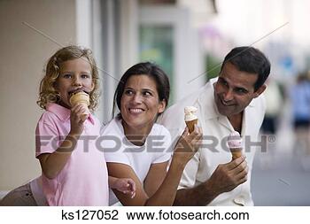 Stock Photo - family eating 
ice cream cones 
together. fotosearch 
- search stock 
photos, pictures, 
images, and photo 
clipart