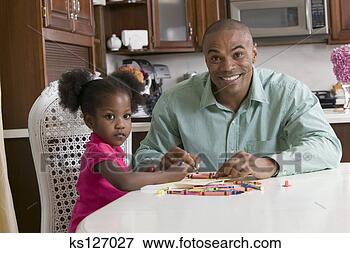 Picture - father and daughter 
coloring with 
crayons. fotosearch 
- search stock 
photos, pictures, 
images, and photo 
clipart