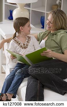 Stock Photo - mother and daughter 
reading book together. 
fotosearch - search 
stock photos, 
pictures, images, 
and photo clipart
