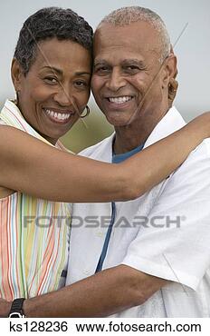 Stock Photo - couple embracing 
outdoors. fotosearch 
- search stock 
photos, pictures, 
images, and photo 
clipart