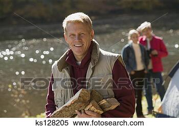 Stock Image - man with firewood. 
fotosearch - search 
stock photos, 
pictures, images, 
and photo clipart