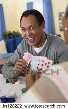 Stock Photo - man playing poker. 
fotosearch - search 
stock photos, 
pictures, images, 
and photo clipart