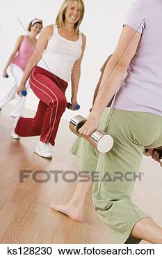 Stock Photography - women doing aerobics 
with dumbbells. 
fotosearch - search 
stock photos, 
pictures, images, 
and photo clipart