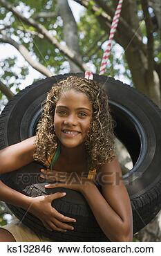 Stock Photo - girl on tire swing. 
fotosearch - search 
stock photos, 
pictures, images, 
and photo clipart