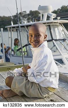 Stock Image - smiling boy with 
fishing pole. 
fotosearch - search 
stock photos, 
pictures, images, 
and photo clipart
