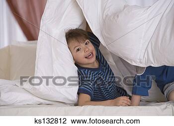 Stock Photo - smiling boy playing 
with blanket. 
fotosearch - search 
stock photos, 
pictures, images, 
and photo clipart