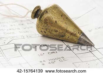 Stock Photograph - plumb bob lying 
on blueprint. 
fotosearch - search 
stock photos, 
pictures, images, 
and photo clipart