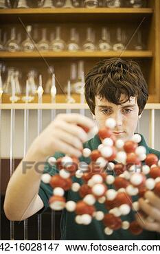 Picture - teenage boy fascinated 
by chemistry. 
fotosearch - search 
stock photos, 
pictures, images, 
and photo clipart