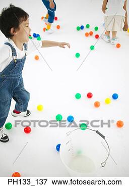 Picture - young children 
playing with colored 
plastic balls. 
fotosearch - search 
stock photos, 
pictures, images, 
and photo clipart