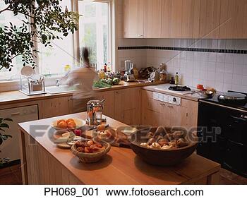 Stock Photography - woman at kitchen 
basin. fotosearch 
- search stock 
photos, pictures, 
images, and photo 
clipart