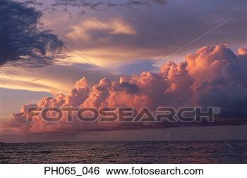 Stock Photo - sunset clouds 
over ocean. fotosearch 
- search stock 
photos, pictures, 
images, and photo 
clipart