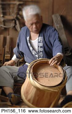 Stock Photo - carpenter looking 
at a barrel. fotosearch 
- search stock 
photos, pictures, 
images, and photo 
clipart