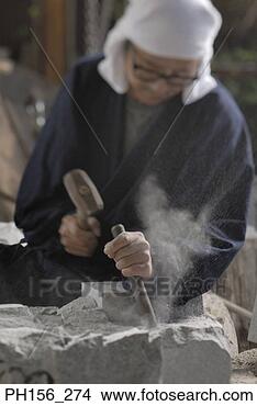 Stock Photo - sculptor carving 
a stone with a 
chisel and a hammer. 
fotosearch - search 
stock photos, 
pictures, images, 
and photo clipart