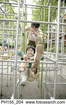 Stock Photo - mid adult man 
with his son playing 
on a jungle gym. 
fotosearch - search 
stock photos, 
pictures, images, 
and photo clipart