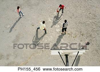 Stock Photo - high angle view 
of five people 
playing basketball. 
fotosearch - search 
stock photos, 
pictures, images, 
and photo clipart