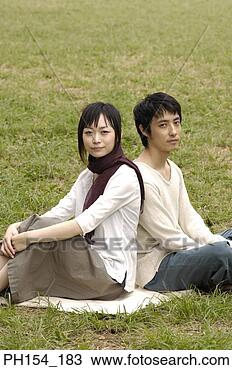 Stock Photo - portrait of a 
young couple sitting 
together. fotosearch 
- search stock 
photos, pictures, 
images, and photo 
clipart