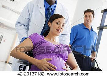 Stock Photo - pregnant woman 
arriving at hospital. 
fotosearch - search 
stock photos, 
pictures, images, 
and photo clipart