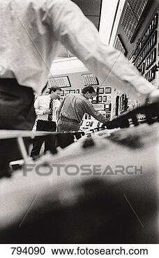 Stock Photography - engineers at control 
panel of a power 
station. fotosearch 
- search stock 
photos, pictures, 
images, and photo 
clipart