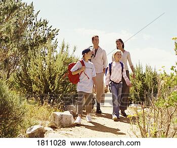 Stock Photo - family on a day 
out walking along 
a path. fotosearch 
- search stock 
photos, pictures, 
images, and photo 
clipart