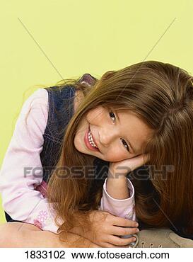 Stock Photo - portrait of a 
shy young girl. 
fotosearch - search 
stock photos, 
pictures, images, 
and photo clipart
