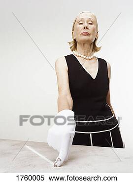 Stock Image - snobby senior 
woman wearing 
a white glove 
pointing to dirt. 
fotosearch - search 
stock photos, 
pictures, images, 
and photo clipart