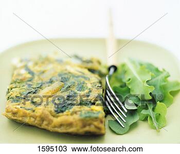Stock Photo - spinach omelette 
and lettuce on 
a plate, fork 
in between. fotosearch 
- search stock 
photos, pictures, 
images, and photo 
clipart