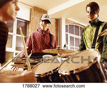 Picture - three boys in 
a music band practising. 
fotosearch - search 
stock photos, 
pictures, images, 
and photo clipart