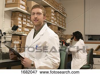 Picture - two lab technicians 
working in a laboratory. 
fotosearch - search 
stock photos, 
pictures, images, 
and photo clipart