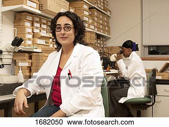 Stock Photography - two research scientists 
in a laboratory. 
fotosearch - search 
stock photos, 
pictures, images, 
and photo clipart