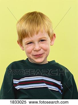 Stock Image - young boy looking 
displeased. fotosearch 
- search stock 
photos, pictures, 
images, and photo 
clipart