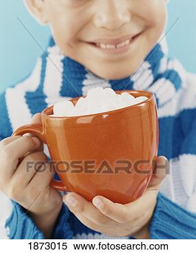 Stock Image - close up of a 
boy holding a 
drinking cup. 
fotosearch - search 
stock photos, 
pictures, images, 
and photo clipart