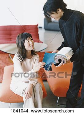 Stock Photo - thirtysomething 
couple in a home 
decorating shop 
looking at fabric. 
fotosearch - search 
stock photos, 
pictures, images, 
and photo clipart