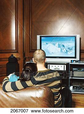 Picture - rear view of a 
couple watching 
a widescreen television. 
fotosearch - search 
stock photos, 
pictures, images, 
and photo clipart