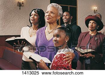 Stock Image - family standing 
in church pews 
holding bibles 
and listening 
to a. fotosearch 
- search stock 
photos, pictures, 
images, and photo 
clipart