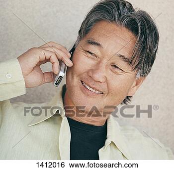 Stock Photo - mature man using 
a mobile phone. 
fotosearch - search 
stock photos, 
pictures, images, 
and photo clipart