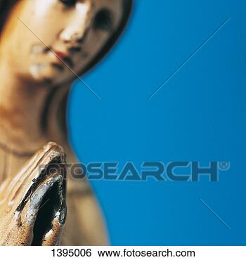 Stock Photo - figurine of the 
virgin mary with 
her hands together 
in prayer. fotosearch 
- search stock 
photos, pictures, 
images, and photo 
clipart