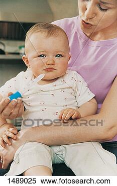 Stock Image - portrait of a 
baby sitting on 
her mother's lap, 
 and her mother. 
fotosearch - search 
stock photos, 
pictures, images, 
and photo clipart