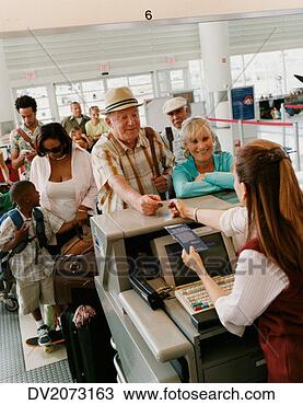 Stock Photo - senior couple 
check in at an 
airport. fotosearch 
- search stock 
photos, pictures, 
images, and photo 
clipart