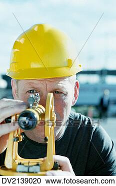 Stock Photography - surveyor looking 
through a theodolite. 
fotosearch - search 
stock photos, 
pictures, images, 
and photo clipart