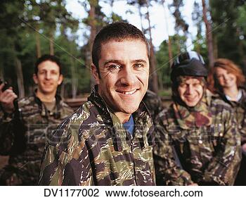 Stock Photo - portrait of a 
man paintballing 
with friends dressed 
in camouflage. 
fotosearch - search 
stock photos, 
pictures, images, 
and photo clipart