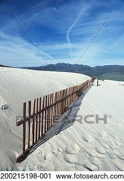 Stock Photography - spain, andalucia, 
costa de la luz, 
fence crossing 
dunes. fotosearch 
- search stock 
photos, pictures, 
images, and photo 
clipart