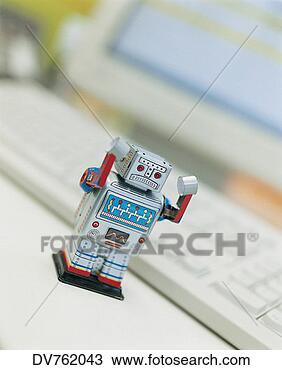 Stock Photo - toy robot on an 
office desk. fotosearch 
- search stock 
photos, pictures, 
images, and photo 
clipart