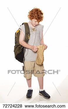 Stock Photo - boy (9-11) with 
backpack, holding 
paper bag in studio. 
fotosearch - search 
stock photos, 
pictures, images, 
and photo clipart