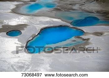 Picture - 'aerial view of 
silt and turquoise 
water in an alaska 
glacier, alaska'. 
fotosearch - search 
stock photos, 
pictures, images, 
and photo clipart
