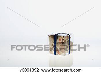 Stock Photo - banknotes inside 
clear gift box, 
studio shot. fotosearch 
- search stock 
photos, pictures, 
images, and photo 
clipart
